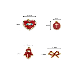 Red enamel pendant collection with heart and bow charms in 18k gold plated metal