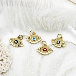 Detailed view of 18K gold plated evil eye charms in four colors for DIY jewelry making