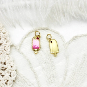 Macro shot of 18K gold plated ice cream pendants with pink enamel and micro-inlaid details