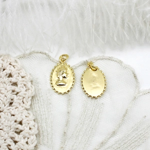 Macro detail of 18K gold-plated queen portrait oval pendants for jewelry making
