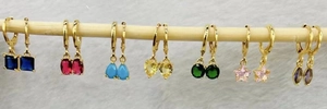 Colorful gemstone drop earrings featuring gold plated hooks and assorted zircon charms
