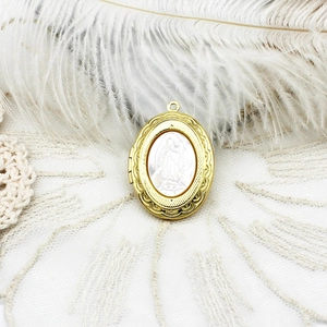 18K gold plated oval locket necklace with Virgin Mary relief on white feathers