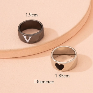 Minimalist heart and V-letter couple ring set in silver and black stainless steel