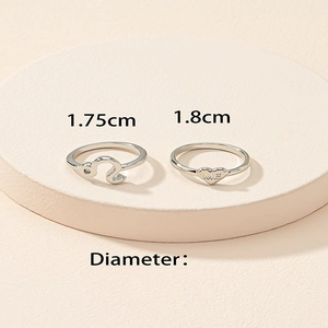 Set of silver rings featuring Leo zodiac symbol and heart charm with ME engraving