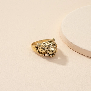 Bold vintage gold tiger head ring with detailed 3D carving for a street style look