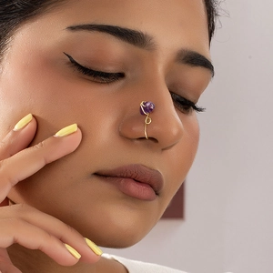 Handmade gold wire-wrapped nose ring with purple gemstone for non-pierced nose