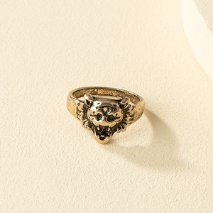 Detailed view of vintage gold animal ring with a highly detailed lion head carving