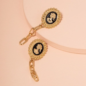 Vintage gold-tone portrait cameo earrings with geometric chain fringe design