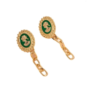 Vintage gold drop earrings with green enamel cameo and geometric chain detail