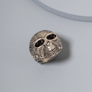 Vintage punk silver skull ring for men with black gemstones and intricate floral engravings