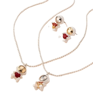 Astronaut jewelry set with heart and flower motifs including necklaces and stud earrings