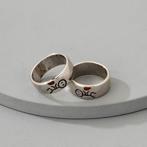 Vintage silver couple rings with stickman graphics and red heart accents in retro style
