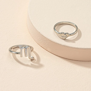 Silver constellation rings set with Scorpio symbol and engraved heart shaped ME band