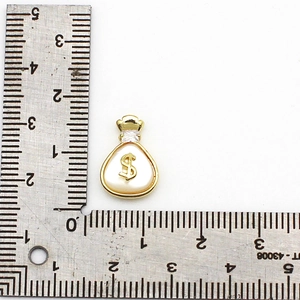 18K gold-plated money bag pendant with shell inlay and dollar sign measured on a ruler