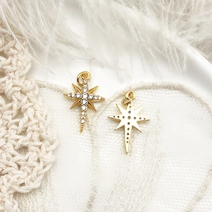 Detailed front and back view of 18K gold star pendant with sparkling cubic zirconia pavé