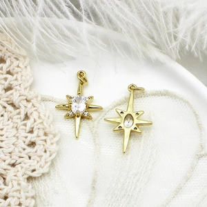 Close-up of 18K gold plated hexagram star pendants with zircon inlay on lace