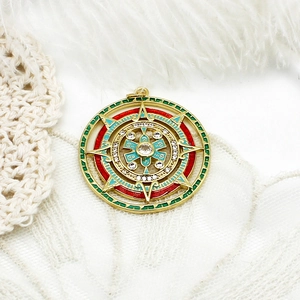 Exquisite gold sunburst pendant with red and green enamel and micro-set zircon stones