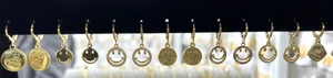 Collection of 14K gold plated hoop earrings with diverse smiley face and evil eye charms