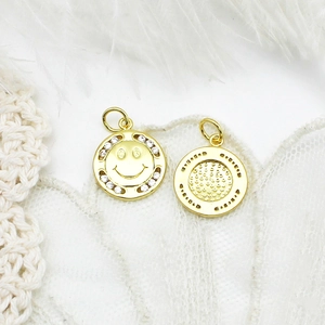 Detail of 18K gold plated smiley face charms with white cubic zirconia for DIY jewelry