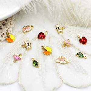 Colorful DIY nature charms in strawberry bee and leaf shapes with 18K gold plating