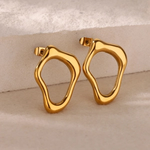 Modern 18k gold-plated geometric hollow earrings on minimalist stone pedestal
