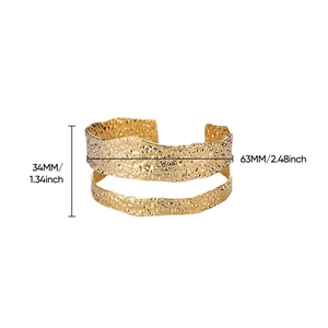 Detail view of 18K gold plated wide cuff bracelet showing 34mm height and hammered texture