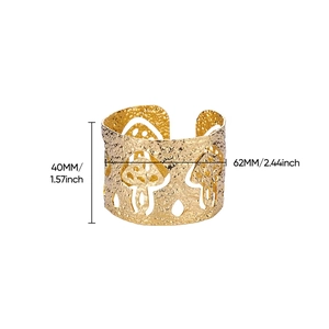 Detail showing 40mm wide 18K gold mushroom cutout cuff bracelet with hammered texture finish