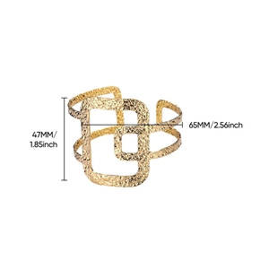 Close-up of golden wide open cuff bracelet with hammered texture and 47mm width dimensions
