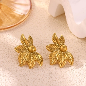Detailed view of 18k gold butterfly leaf earrings with leaf vein texture and golden bead