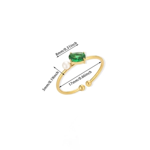 Adjustable gold plated titanium ring with green oval gemstone and small white pearl detail