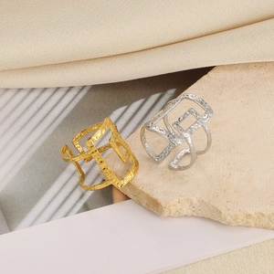 Irregular geometric open rings in gold and silver finish with lava texture