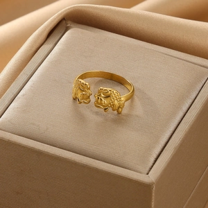 Detailed view of a gold-plated adjustable double fish open ring with scale textures