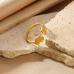 Detailed macro view of golden open ring with exquisite mythical creature carvings