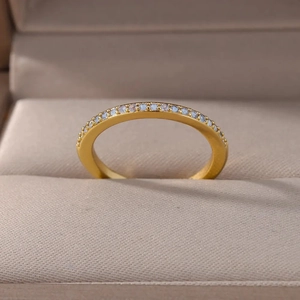 Elegant gold-plated ring with shimmering light blue zircon stones in a row design
