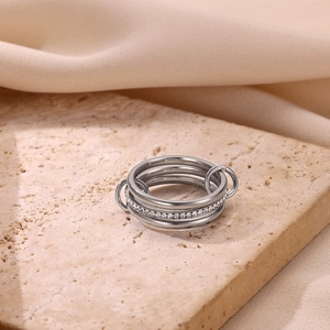 Triple stacked stainless steel linking rings with pavé crystal accents in silver finish