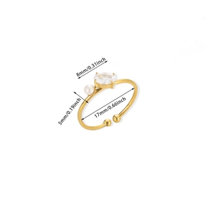 Detailed view of adjustable gold ring with 8mm oval faux diamond and 5mm pearl measurements