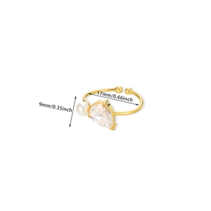 Detail showing adjustable gold ring size with pearl and pear-cut gemstone dimensions