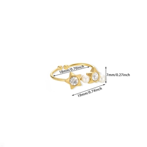 Detail view of gold star and pearl ring with precise dimensions in inches and mm