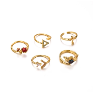 Five-piece vintage gold ring set featuring rose, cross, and triangle crown designs