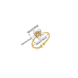 Detailed view of adjustable gold-toned flower ring with faux pearls and sparkling crystals