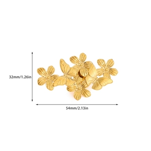 Macro view of golden sun-flower and butterfly brooch with brushed metal texture details