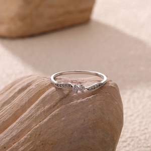 Elegant 18k white gold plated wave ring featuring sparkling double zircon stones