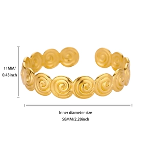 Golden stainless steel cuff bracelet with vintage spiral vortex pattern design
