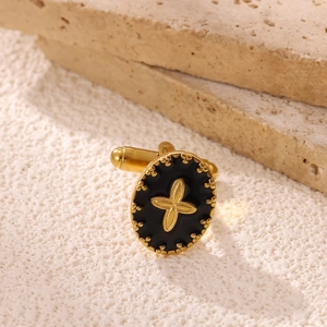 Oval gold stainless steel cufflinks with black enamel and gold star on stone base