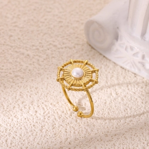 Macro detail of 18K gold plated flower ring featuring a white pearl and adjustable band
