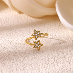 Macro view of 18K gold plated ring with sparkling crystal-encrusted double stars