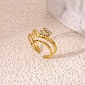 Detail of 18K gold-plated double-layer ring featuring a hollow heart and pavé zircons