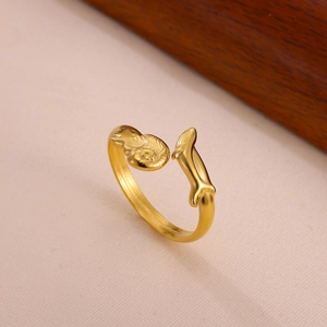 Detail of adjustable gold ring with embossed texture and smooth metallic finish