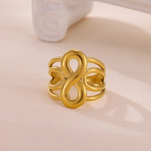 Polished gold plated stainless steel wide ring featuring hollow infinity heart pattern