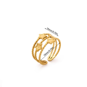 Detail shot of triple-layer gold ring with star motifs and 18mm diameter measurement
